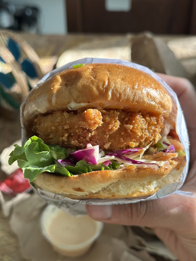 Delicious crispy chicken sandwich with fresh vegetables