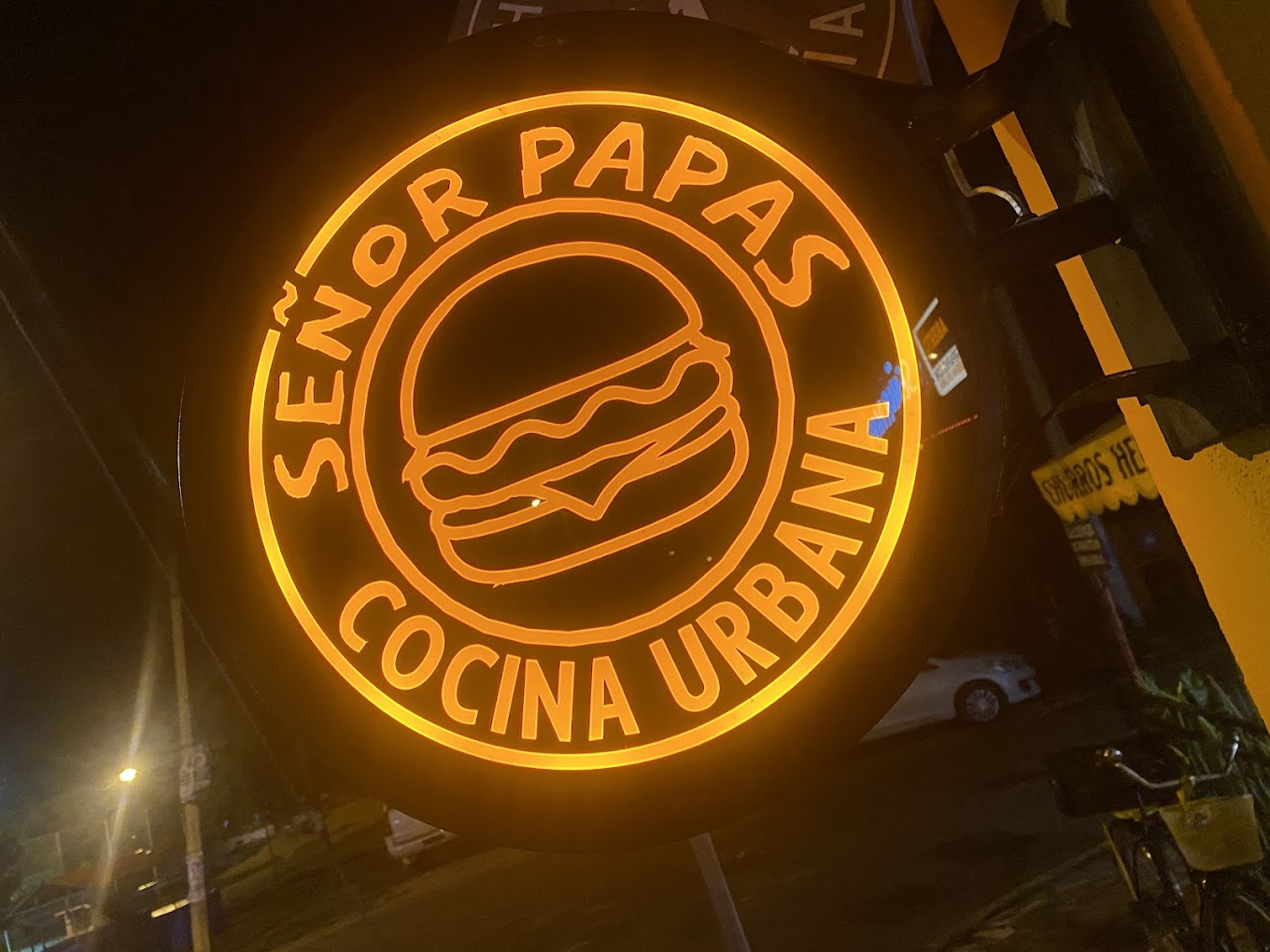 Señor Papas neon sign at night